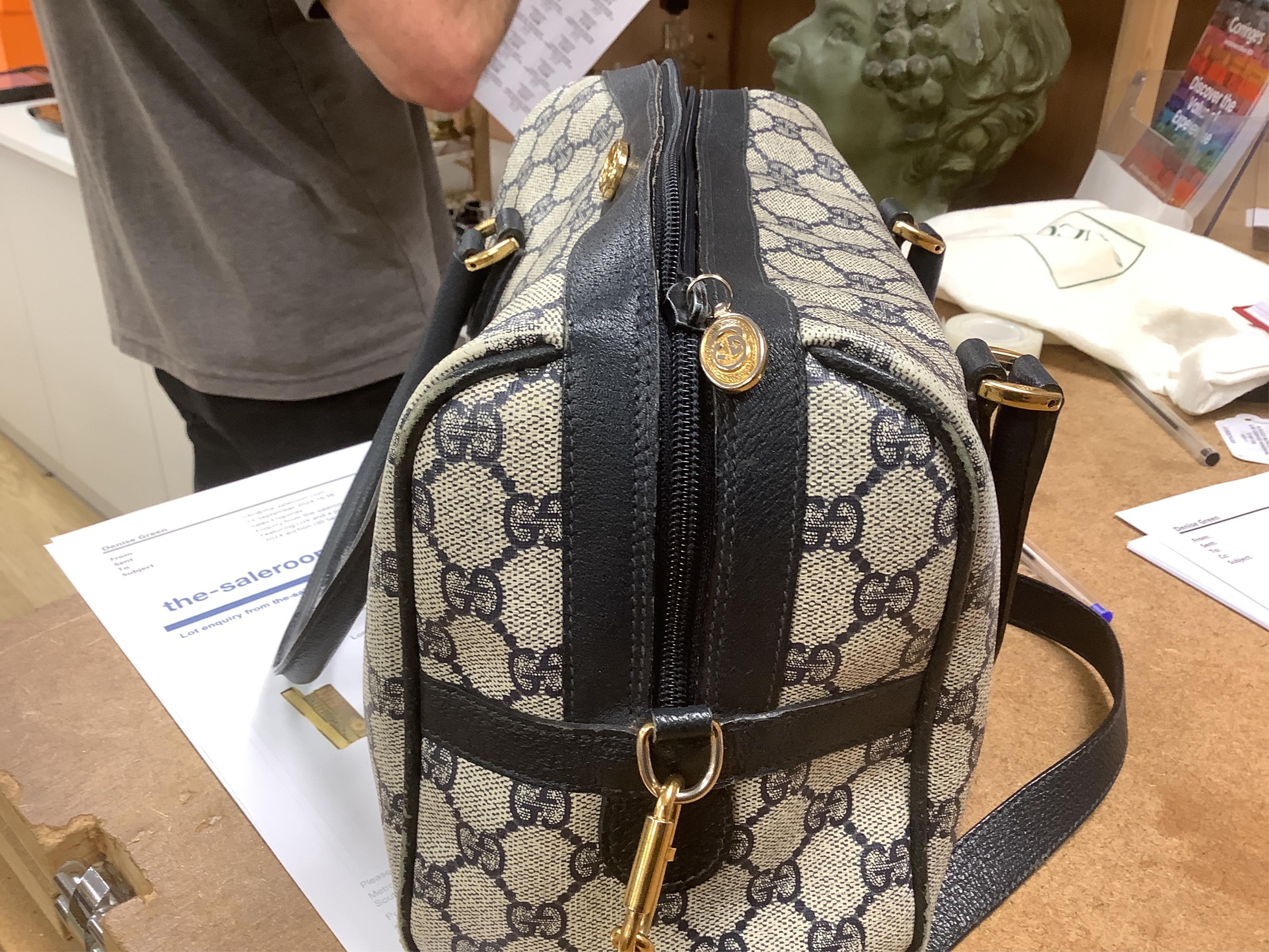 A Gucci monogram blue canvas handbag, wallet and purse